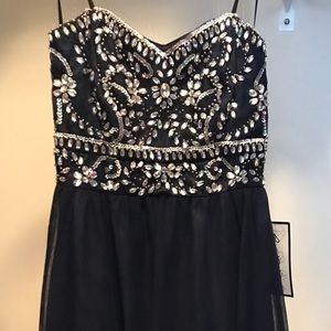 Navy blue strapless, tee length gown